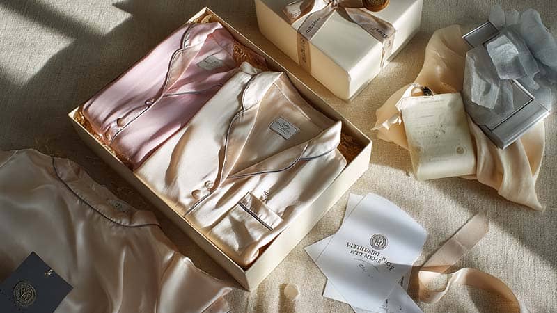 Elegant custom silk sleepwear in a luxury gift box with branded packaging, ideal for premium B2B presentation
