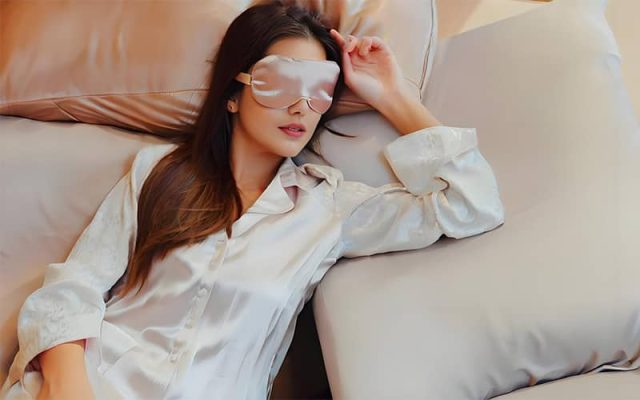 Woman Sleeping on a Silk Pillowcase for Skin and Hair Benefits